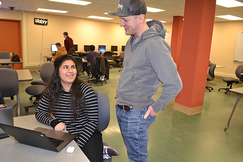 Geoffrey Challen interacts with a student.