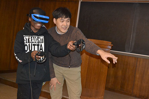 I-MRSEC’s Kising Kang introduces a Franklin student to Virtual Reality (VR).