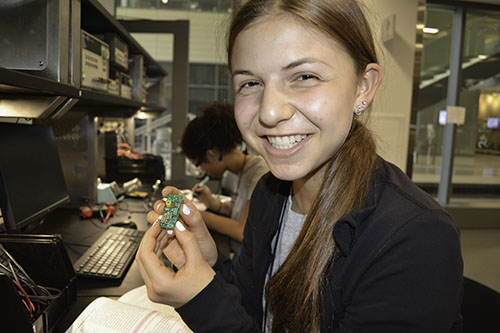 A 2019 GLEE camper shows the circuit she's been soldering.