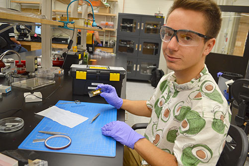 I-MRSEC REU participant Lucas Komara at work in Arend van der Zande's lab.