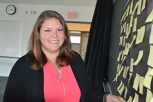 Meagan Pollock examines teachers’ notes of their aha moments during Pollock’s training.