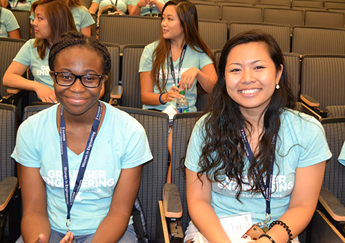 Freshmen Benedicta Udeogu and Sue Wee wait for WIE Orientation to begin.