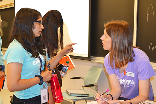 During one of the afternoon advising sessions, Brooke Newell (right) gives a freshman some advice.