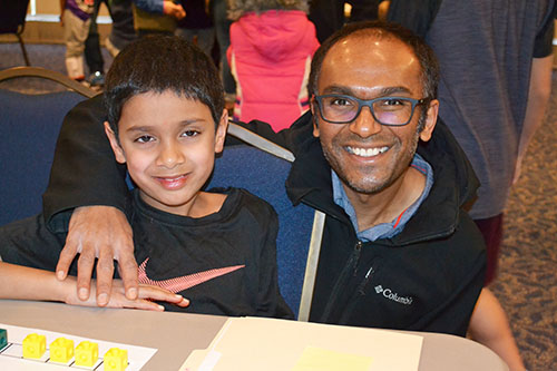 Sandeep Pulluru (right) and his son enjoying the carnival.