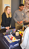 Design for America members Brianna Creviston and Kirtan Patel run DFA's 2019 Engineering Open House booth.