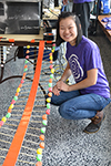 An Illinois student stands with their candy wave demo.