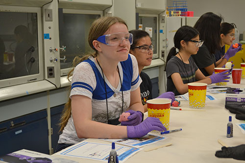 GLAM campers listen to instructions about how to make a mold. (Image courtesy of I-STEM undergrad Sooah Park.)
