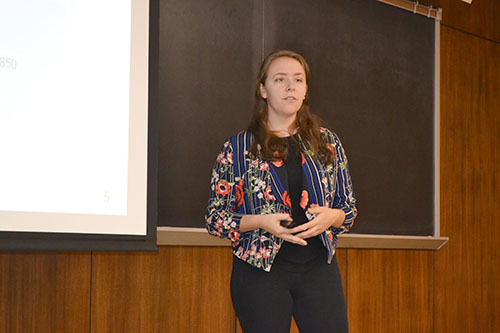 Carmen Paquette presents her research about synthesis of antiferromagnetic materials to visitors at the REU's August 2nd final presentation event.