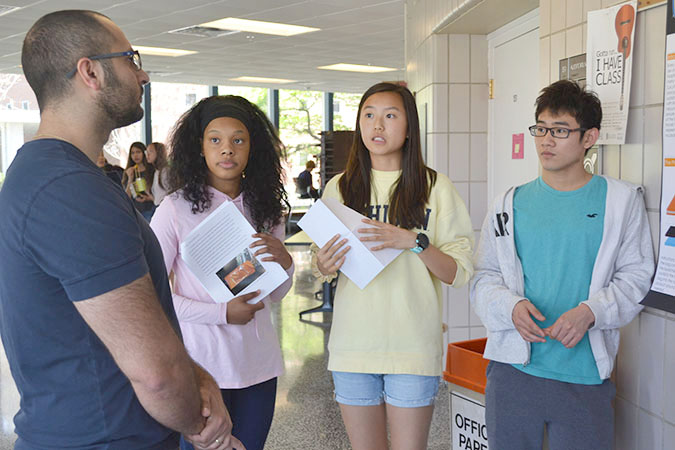 Uni High Students present their incubators to one of the judges, Patrick Birbarah (left).