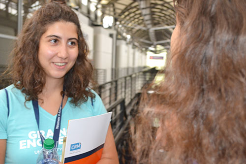 A freshman chats with her mentor by Engineering Career Services in DCL.