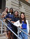 Engineering seniors Courtney Leverenz, Shivani Ganesh, Eugenia Maldonado, and Berat Gulecyuz by the Engineering Hall sign.