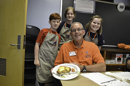 A team of students with the judge who tasted their food in the Food Challenge session.
</div>