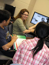 Jennifer Amos demonstrating Atomic Force Microscope to igert grad students.