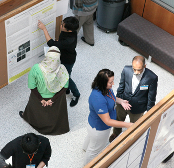 Irfan Ahmad discusses research with grad student.