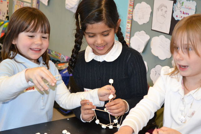 Three BTW students enjoy making their marshmallow/toothpick tower