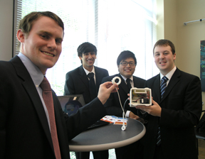 Team Real Solutions exhibits the blue-tooth-operated gastric band pump they designed.