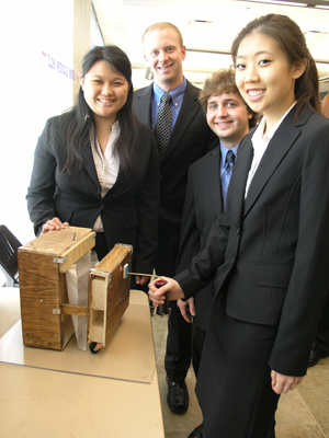 BioE students display the bag sorter they designed for the Developmental Services Center.