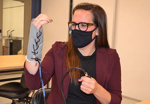 In a recent BioE class, Holly Golecki demonstrates how the Soft Robotics Toolkit wrist brace works.