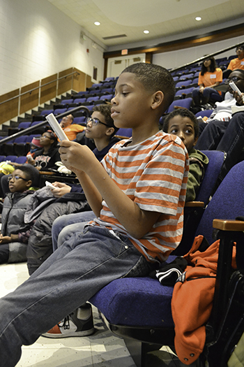  A Chicago youngster who visited campus for the fall 2015 campus visit to <em>Illinois</em> uses an i>clicker.