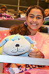 A Chic Tech participant gets cozy with her stuffed animal during Girls' Night.