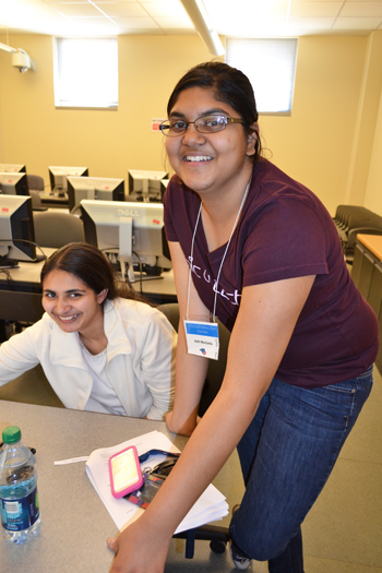 Aditi Mocharla (right) works with a student in the workshop where students made their own computers using Raspberry Pi