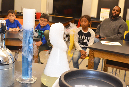 Local DREAAM House boys experience how liquid nitrogen can impact various materials.