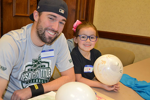 A local dad and his daughter enjoy Dads 4 Daughters.