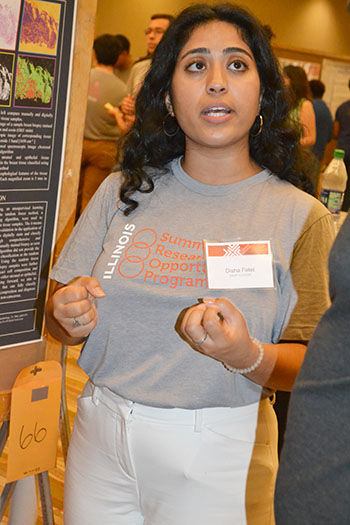 Disha Patel presents her research  during the Illinois Summer Research Symposium.