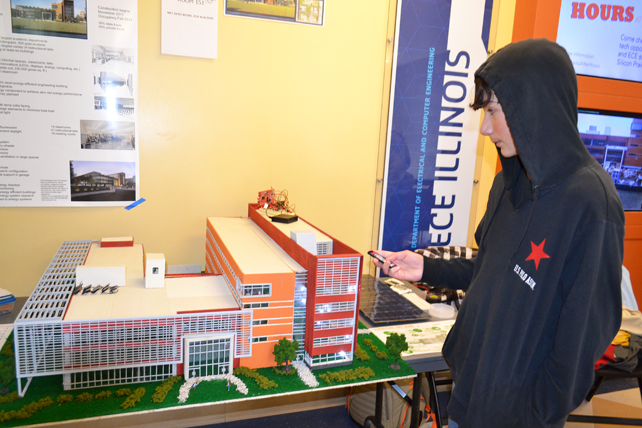 A young visitor to EOH 2014 plays with the lights in a model of the new ECE building.