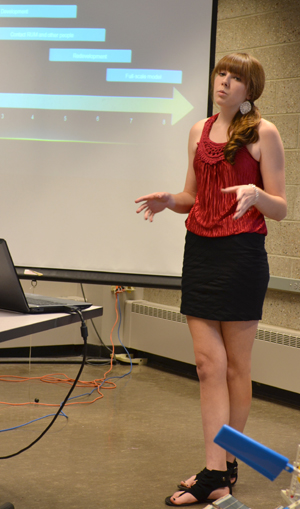 PowerHouse team member Alexis Clinebell discusses their project during the final presentation.