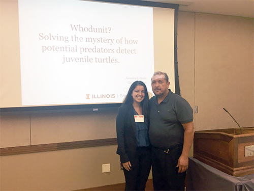 Alondra Estrana (left) with her father at her presentation for her research.
