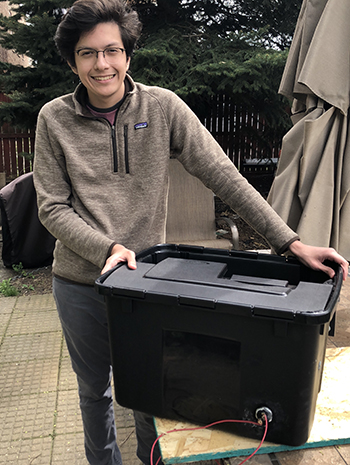 MechSE freshman Fabrizzio Vega and his Steam Box Disinfector, useful for disinfecting various items, such as face masks, for reuse. (Photo courtesy of Fabrizzio Vega.)