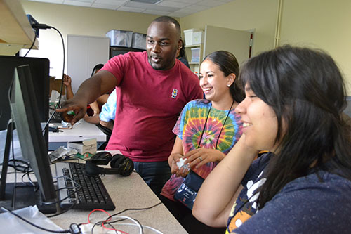 Gabriel Burks works with BioE GAMES campers.