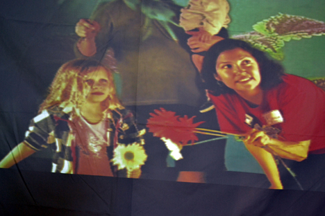 This is an image of the video the young visitor and grad student Lorena Rios saw of themselves dancing with plants.