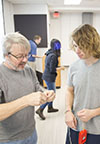 Mats Selen (left) works with a Physics 211 student on an iOLab activity.