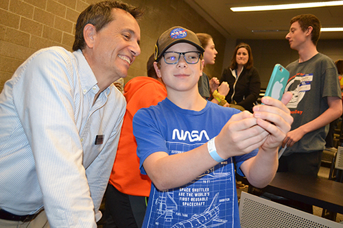 Brandon Roady (right), takes a selfie with keynote speaker Leon Liebenberg after his presentation.