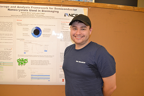 An INCLUSION REU participant, Patrick Shinn, by his poster about building a framework for data collection for semiconductor nanocrystals.