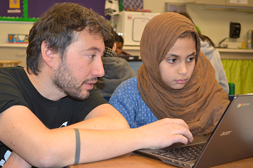 Mattia Gazzola (left) helps a King student create a keychain using TinkerCAD.