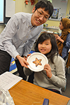 Assistant Professor Chenhui Shao (left), with the student who guessed the shape of her cookie with the fewest toothpicks.