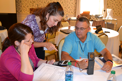 Jennifer McNeilly works with teachers during a math breakout session.