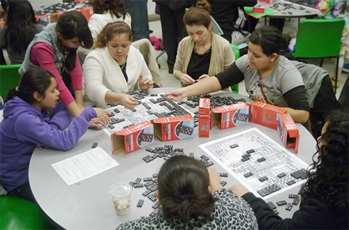 Visitors to Mosaic in fall 2014 build a mosaic out of dominos. (Photo courtesy of Matt Ando) 