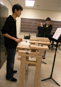 Two contestants rehearsing their pieces.