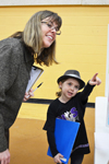 Pint-sized scientist-in-the-making explains her science project to Illinois Psychology professor Kara Federmeier.