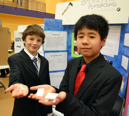 Next Gen 7th graders display their playground equipment they designed.