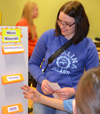 Katie Brown does a hands-on activity with youngsters at Prairie Elementary during a recent after-school activity.