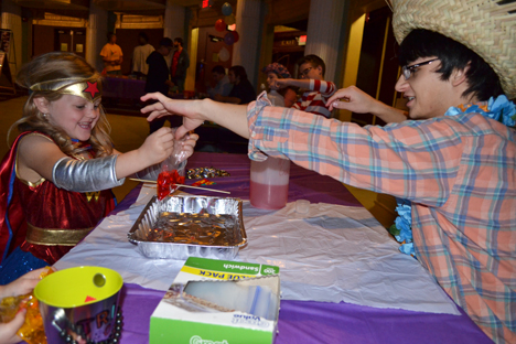 Young Wonder Woman discovers the wonders of chemistry with a REACT student.