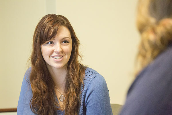 Katie Ansell interacts with one of the Physics 211 students during their first pilot course. (Image courtesy of Brian Stauffer.)