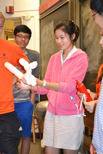 Van trainee displays her skill at creating balloon figures, which trainees would dip in liquid nitrogen.