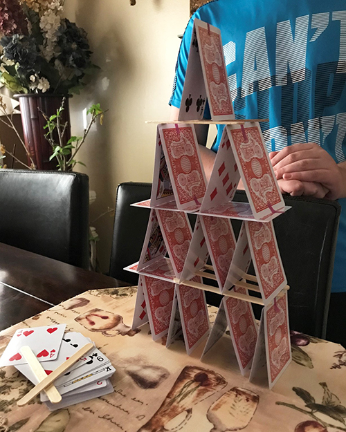 An Engineering Exploration participant exhibits the tower they built as part of the engineering challenge related to Civil Engineering