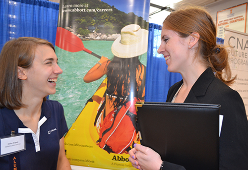 Emily Matijevich (right) chats with  Abbott recruiter Claire Slupski 